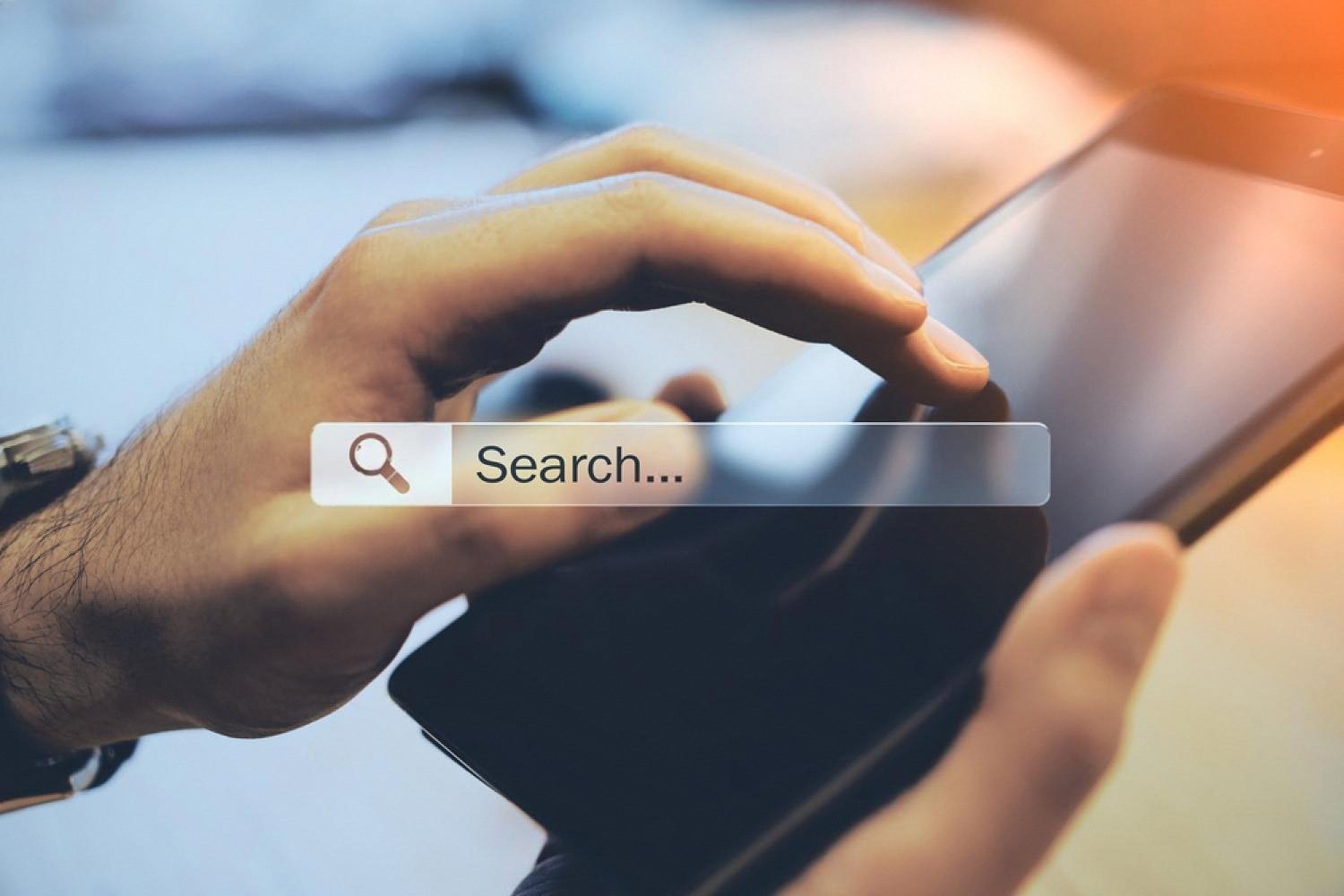 Close-up of a person searching on a tablet, illustrating domain and search trust
