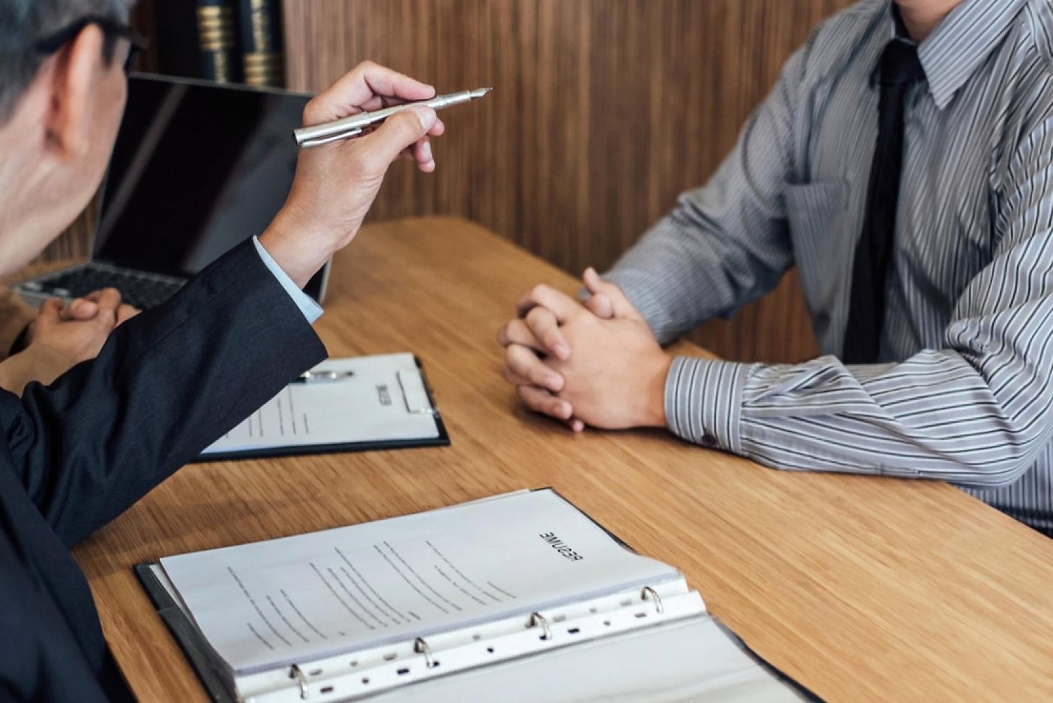 Employee consulting a lawyer about a UAE labour case and legal fees