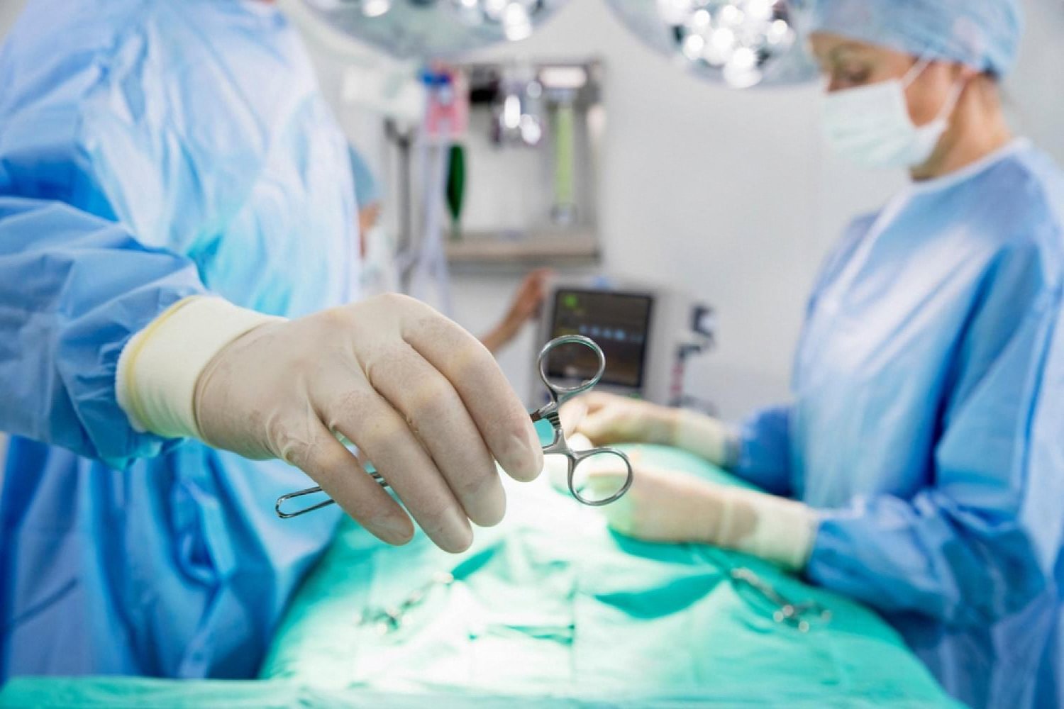 Surgical team performing a minimally invasive colorectal procedure