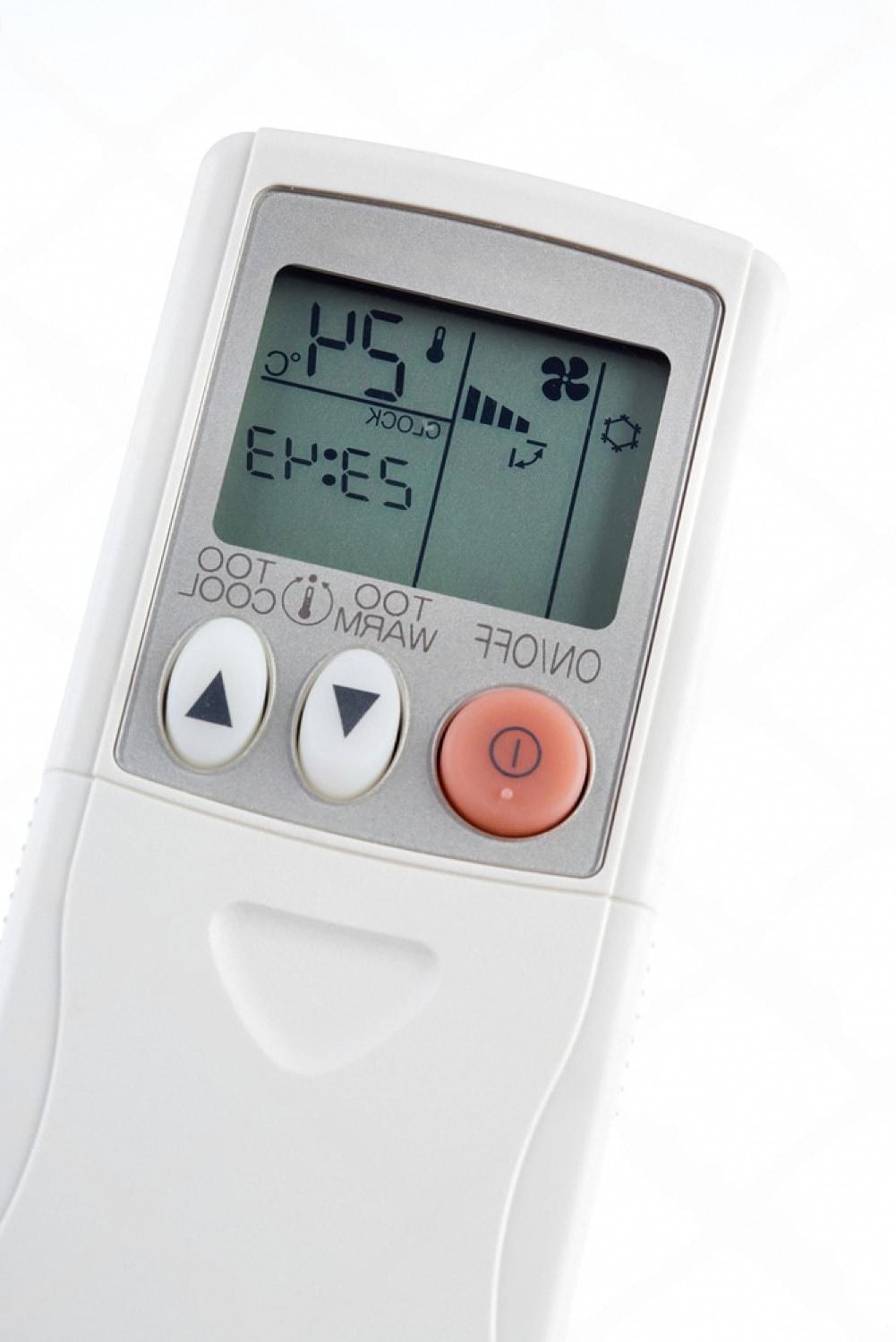 Close-up of a portable air conditioner remote showing temperature and fan settings